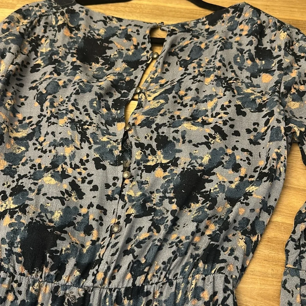 FREE PEOPLE “all the right ruffles” romper